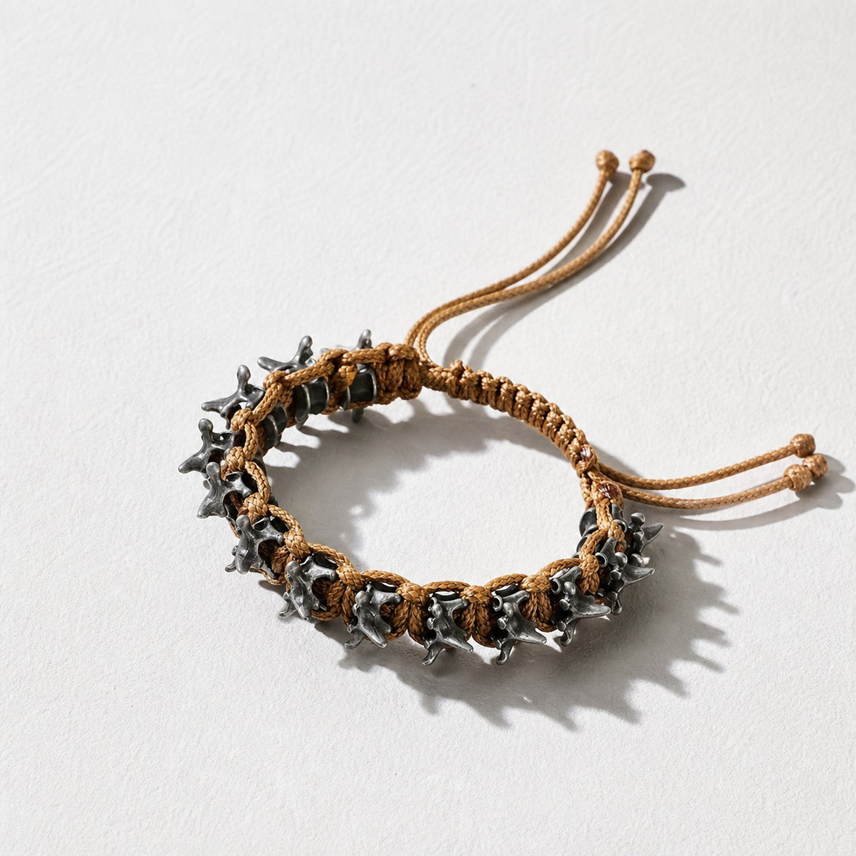 Dark Gothic Dragon Spine Bracelet — brown braided cord — Drokt
